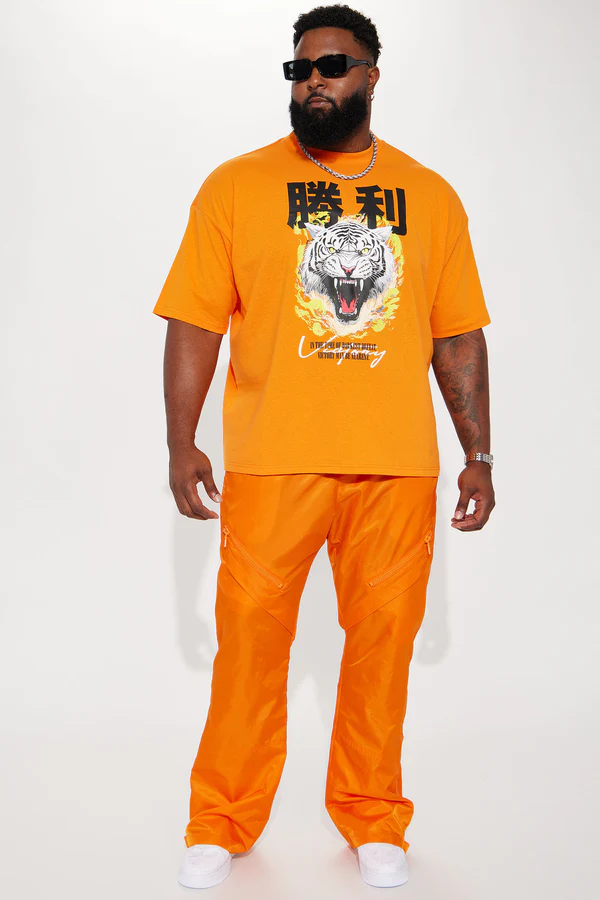 Play The Track Stacked Slim Flare Nylon Pants - Orange